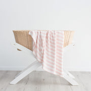Pink bamboo baby blanket swaddle in basket